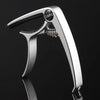 A silver aluminum alloy quick-change guitar capo is shown in a profile view against a dark background.