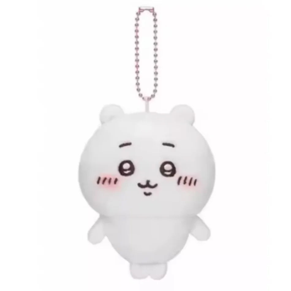 White plush keychain of a cute cat face with a pink beaded necklace
