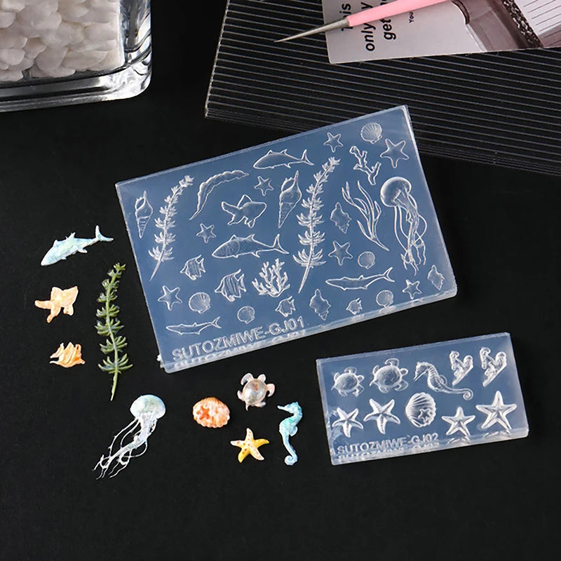 Clear silicone nail art molds featuring various sea creatures and plants for DIY nail design