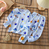 A light blue and white cotton pajama set for children featuring a pattern of space-themed characters and planets.
