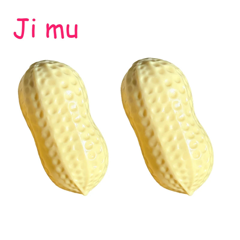 A pair of yellow peanut butter squishy stress balls shown from the side.