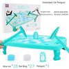 A turquoise penguin breaking ice table game with blue ice and penguin pieces for family fun