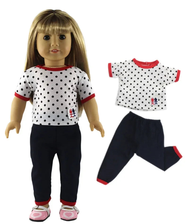A doll wearing a casual outfit set consisting of a white top with black polka dots and navy pants.