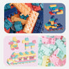 A collection of colorful educational stacking blocks in various shapes and colors like orange, blue, pink, and yellow.