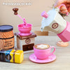 A pretend play tea party set featuring a coffee pot, cup, saucer, and cake for children.