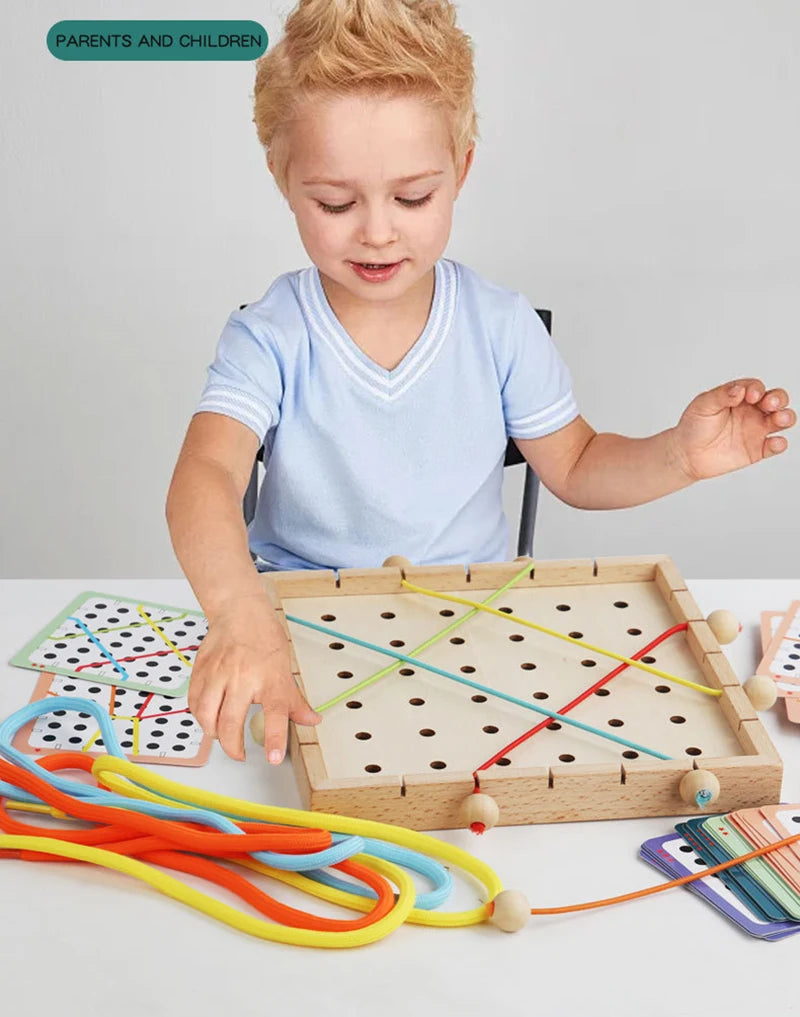 A young child is interacting with a wooden lacing board toy featuring colorful ropes and threads for practice.