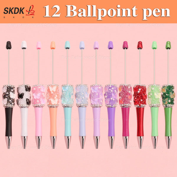 A collection of 12 ballpoint pens featuring various colors and decorative rhinestone beads.