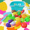 A set of 25 fruit cut chellars in various colors and shapes, including a blue basket and colorful fruit-shaped tools.