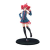 A PVC figure of Hatsune Miku with red hair and a blue outfit standing on a black base.