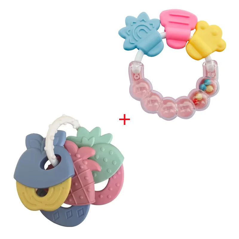 A set of silicone baby teethers in various colors including pink, yellow, blue, and green.