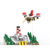 A microscale building blocks set featuring a red and white UFO robot model with a landing pad structure.