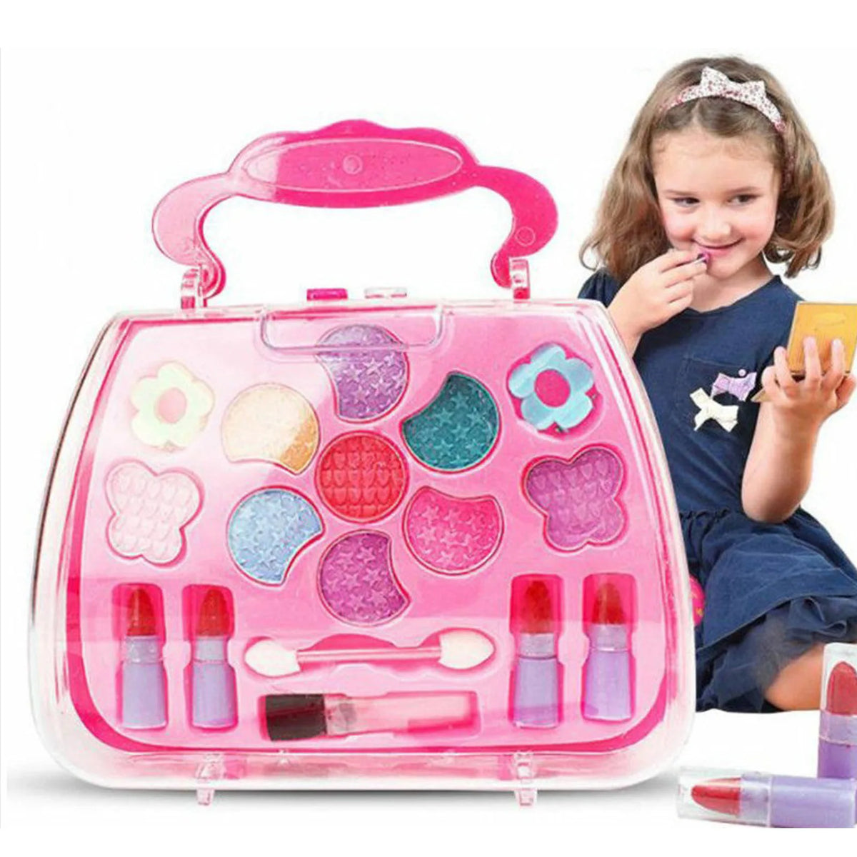 A pink plastic cosmetic case containing various makeup items and a young girl holding it.