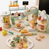 A wooden pretend play kitchen set featuring a coffee maker and various tea accessories for children.