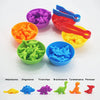 A set of colorful dinosaur-shaped plastic bowls and dinosaurs for sorting and counting.