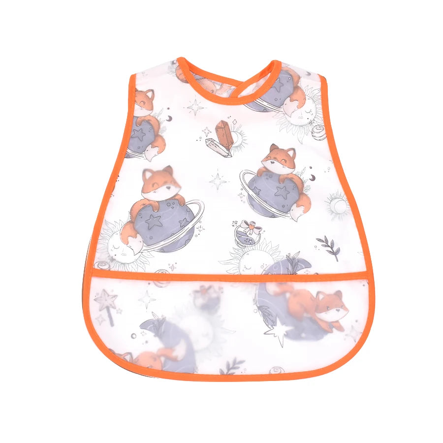 A white baby bib featuring a cartoon pattern of orange foxes sitting in blue bowls.