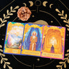 A tarot card deck featuring three cards titled No Reconsider Ask Your Angels set against a dark background with gold celestia
