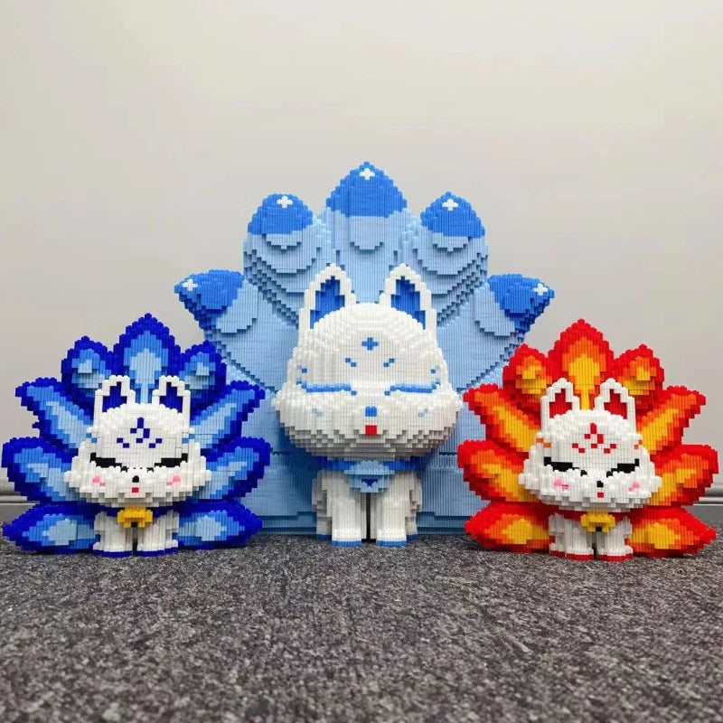 A set of nine-tailed fox figures made from blue and white building blocks.