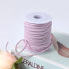 Roll of purple velvet faux suede braided ribbon for crafting and gift wrapping