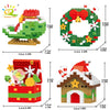 Un set de figurines de Noël en blocs miniatures comprenant un renne, une couronne et une maison.