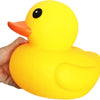A hand is holding a bright yellow rubber duck toy.