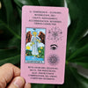 A pink tarot card featuring the Temperance card illustration and text about economy, moderation, and management.