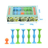 A set of silicone suction cup darts in various colors, including blue and green, packaged in a camouflage box.