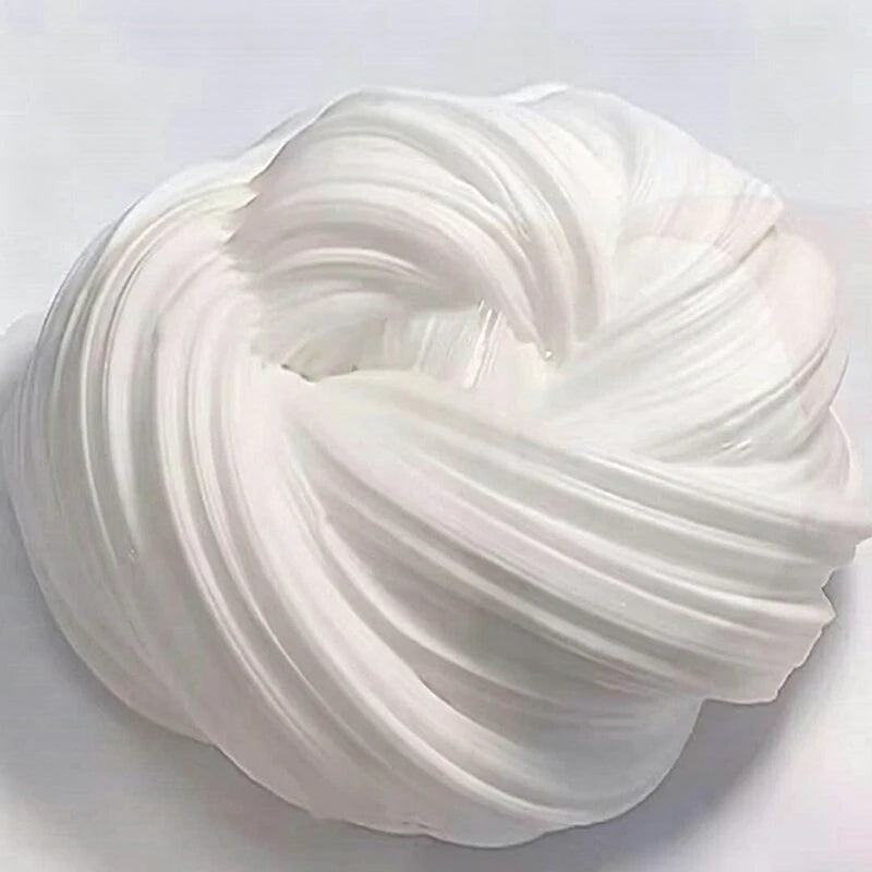 A swirl of clear white stress relief slime is shown on a white surface.