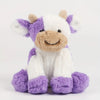 A white and purple plush cow toy with a fluffy snout and ears.
