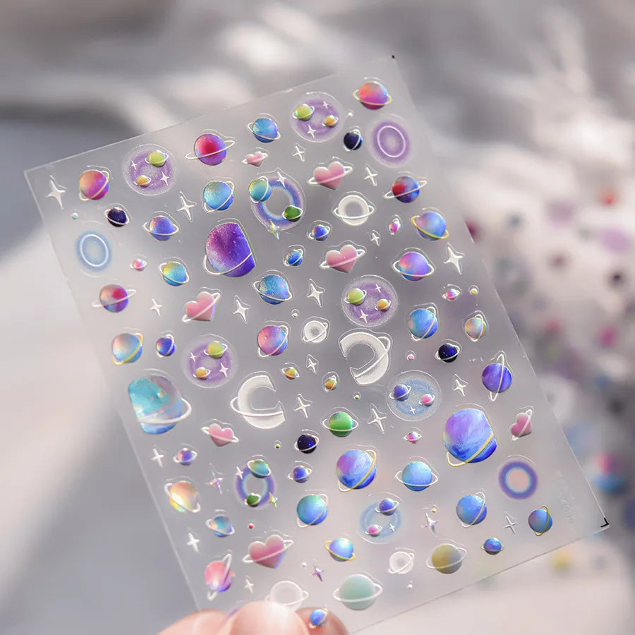 Clear stickers featuring colorful glitter and holographic designs for nail art