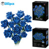 A box of Dark Kiss blue roses and a loose bouquet of blue roses.