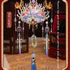 A detailed 3D metal phoenix crown model kit featuring colorful jewels and feathers, displayed on a red background.