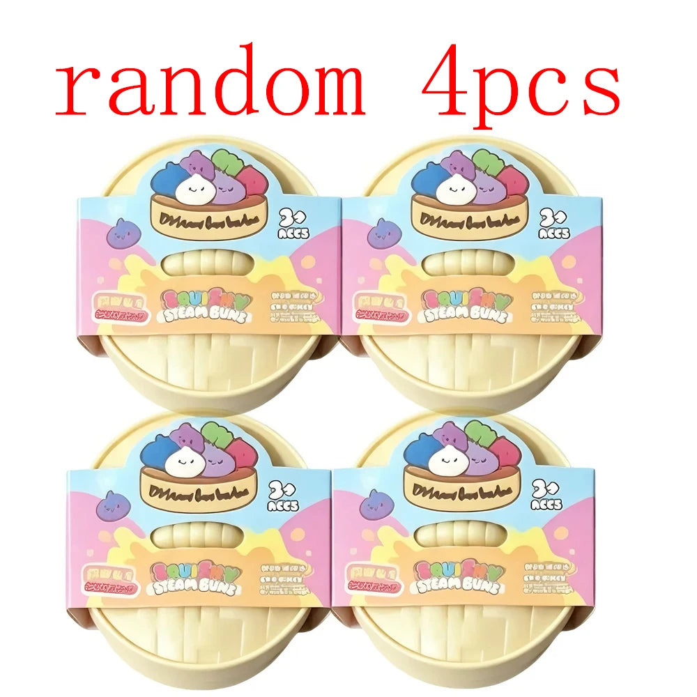 Vier zufällige weiche Dumpling-Sensorspielzeuge in rosa und gelber Verpackung