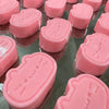 A collection of pink Cat & Cheese squishy stress-relief toys in various shapes and sizes.