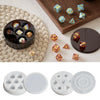 A set of silicone resin molds shaped like hexagons for custom dice boxes and crafting.