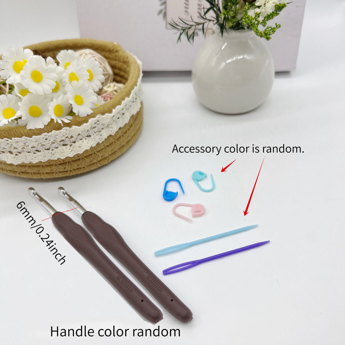 A set of crochet tools including hooks, stitch markers, and needles are displayed on a white surface.