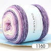 Spool of gradient rainbow yarn in purple and pink shades for knitting and crochet
