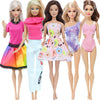 A set of five handmade casual doll outfits for 1/6 scale dolls featuring various pink, purple, and yellow dresses.