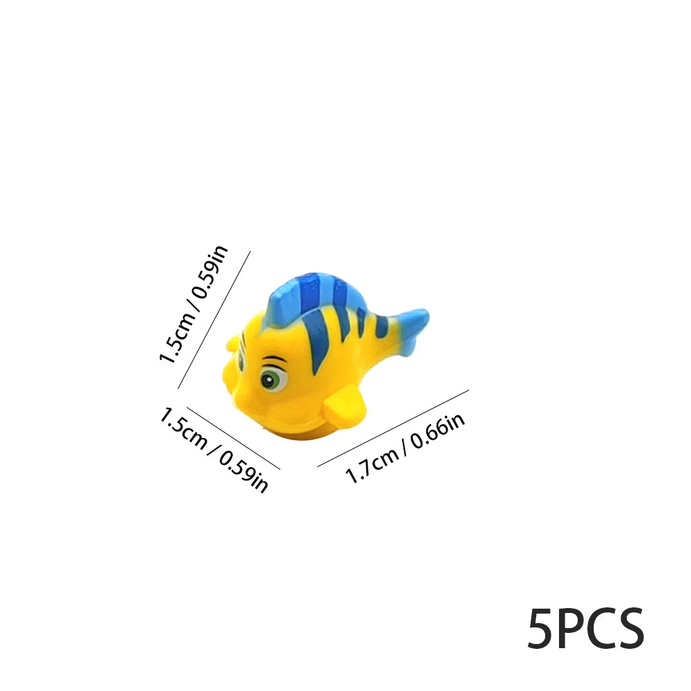 A yellow and blue plastic fish ocean animal building block with a large eye.
