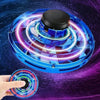 A blue magic LED flying orb boomerang ball with glowing lights is shown being held by a hand.