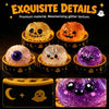 A collection of glossy, glittery ghost-themed squishy toys in various colors and textures.