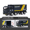 A black medium container truck toy with yellow accents, shown in a side view and close-up.