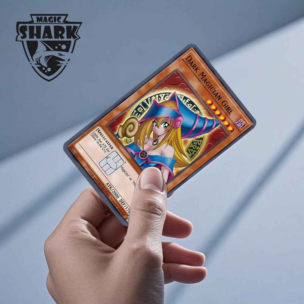 A hand holds a Magic Shark anime dragon PVC card skin sticker featuring a girl with purple hair and a blue outfit.