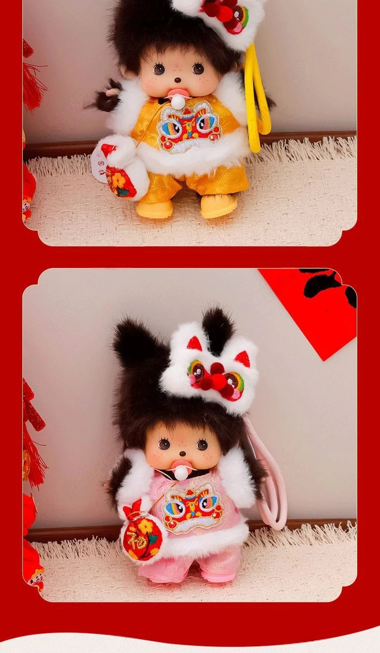 A cute Monchhichi plush keychain in yellow and white with an orange collar and pink accents.