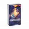 A box of the Divine Celestial Tarot card deck featuring an illustration of two women facing each other with glowing light.