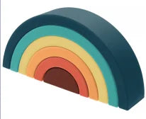 A rainbow-colored arc or arch shape made of soft silicone building blocks.