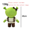 A green collectible plush doll resembling Eminem, XXXTentacion & Frank Ocean with dark hair and brown clothing.