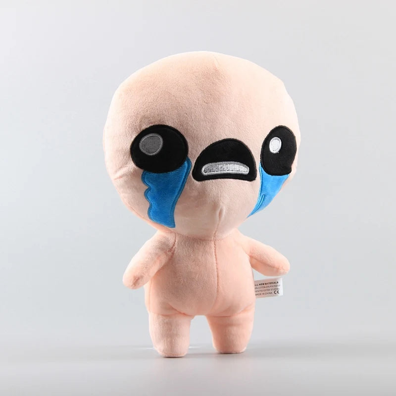 A light pink collectible plush toy with large black eyes and blue markings.
