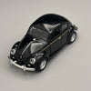 A glossy black classic retro Beetle diecast model car with chrome accents and a gold stripe.