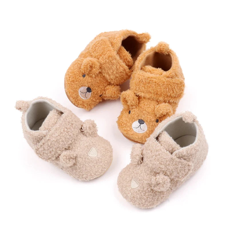 A set of three cute bear design baby prewalker shoes in soft brown and beige colors.