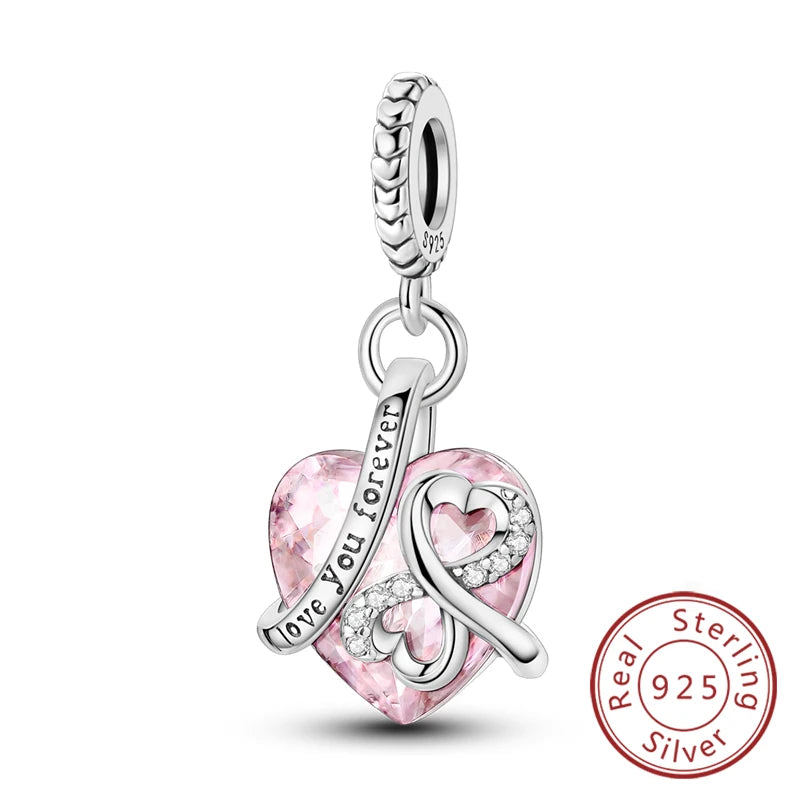 Sterling silver heart charm bead with a pink gemstone and diamond accents